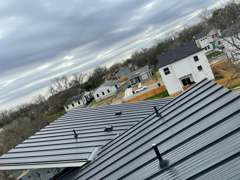 Standing seam metal roof panels with vents for Skylight Repair in Denton